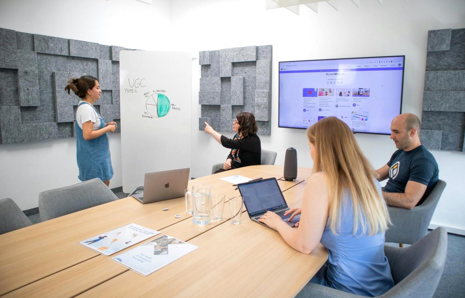 Helena teaching a finance workshop with participants actively engaged in learning